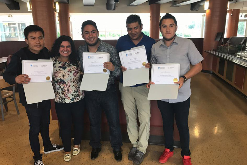 Mexican students with certificates of completion from the ELC.