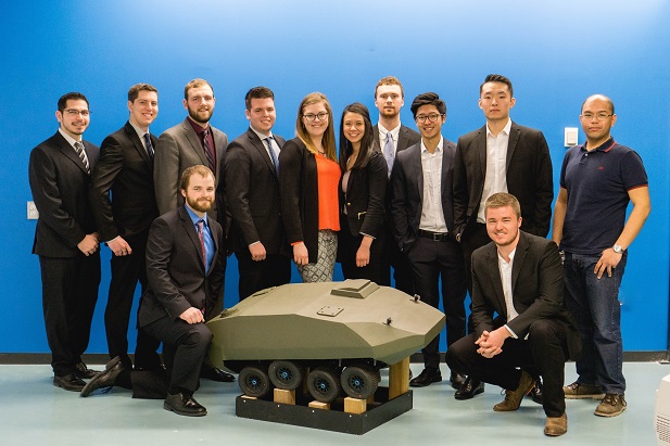 Automotive, Mechanical and Manufacturing Engineering Capstone students with their Electric 8x8 Combat Vehicle.
