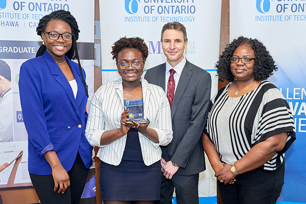 Electrical and Computer Engineering PhD candidate Ololade Sanusi (second from left) celebrates university's 2017 Three Minute Thesis Award. Sanusi went on to place in the top-five in the Ontario competition and advanced to the national competition.