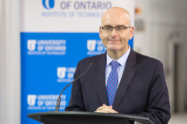 Steven Del Duca, Ontario's Minister of Economic Development and Growth, announces the province's partnership with Magna International Inc., Multimatic Inc. and the University of Ontario Institute of Technology to enhance the university's ACE facility by adding a new Moving Ground Plane.