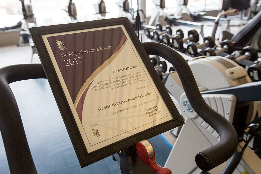 Close up image of Region of Durham's Healthy Workplace Award to the university.