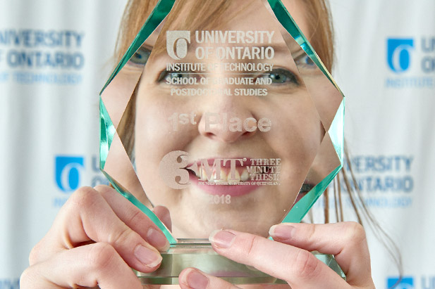 Master of Science degree candidate Eryn Frawley celebrates receiving the first-place award at the university's 2018 Three Minute Thesis competition.