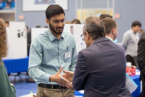 University students meeting with employer representatives at the Fall 2017 Reverse Career Fair in the Campus Recreation and Wellness Centre.