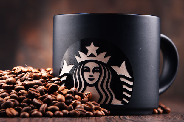 Starbucks mug and coffee beans