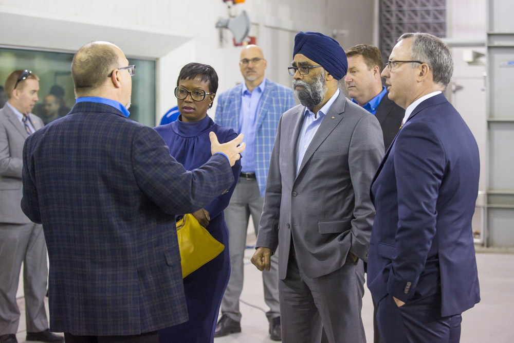 John Komar, Director, Engineering and Operations, ACE, speaks to Celina Caesar-Chavannes, MP, Whitby, Minister Harjit Singh Sajjan and President Steven Murphy about the ACE Climatic Wind Tunnel.