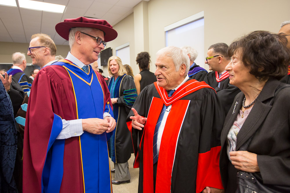 Dr. Tim McTiernan (left), President and Vice-Chancellor (2011 to 2017) chats with Dr. Gary Polonsky (centre), Founding President and Vice-Chancellor (2001 to 2006).