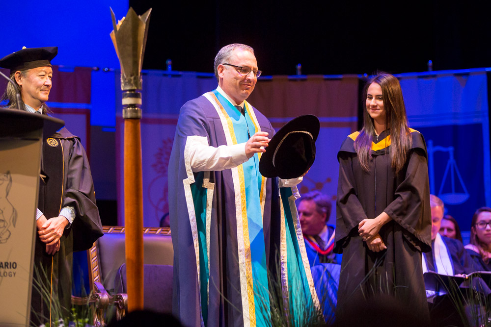 Dr. Steven Murphy accepts the formal Robes of the Office of the President and Vice-Chancellor.