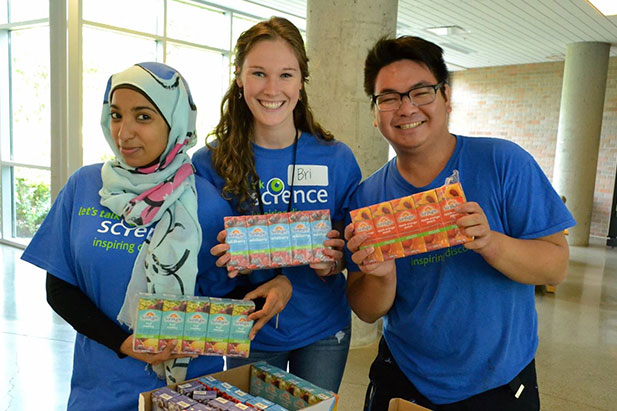 Mannix Chan (far right), Bachelor of Science (Forensic Science) 2014 graduate and two Let’s Talk Science Outreach volunteers prepare for a Let’s Talk Science Challenge event at the University of Victoria. 