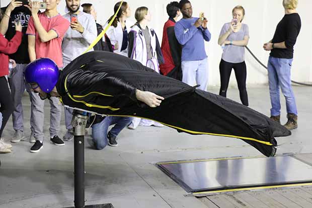 Aerodynamic testing of a wingsuit in front of the nozzle of the ACE Climatic Wind Tunnel at the University of Ontario Institute of Technology.