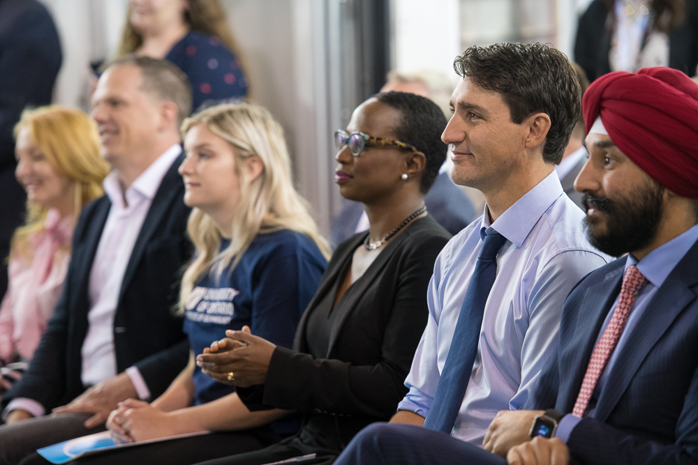 Prime Minister Justin Trudeau (centre) with Celina Caesar-Chavannes, Whitby MP (left) and Navdeep Bains, Minister of Innovation, Science and Economic Development.