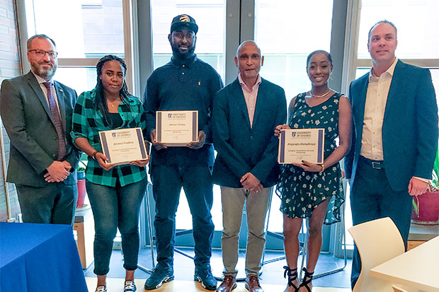 From left: Steven Murphy, PhD, President and Vice-Chancellor; Shiresa Hopkins, first-year Communication; Jervan Casey, first-year Networking and Information Technology; Wesley Crichlow, PhD, Professor, Faculty of Social Science and Humanities; Alejandra Humphreys, first-year Commerce; Joe Stokes, EdD, University Registrar. Absent from ceremony: Devorn Carty, first-year Political Science; Azuredee Mills, first-year Biological Science.