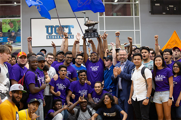 University of Ontario Institute of Technology President Dr. Steven Murphy (right-centre) congratulates students in the Faculty of Engineering and Applied Science which won the 2018 Orientation inter-faculty Wild Goose Chase (top: Stanley the Goose, the Wild Goose Chase trophy).