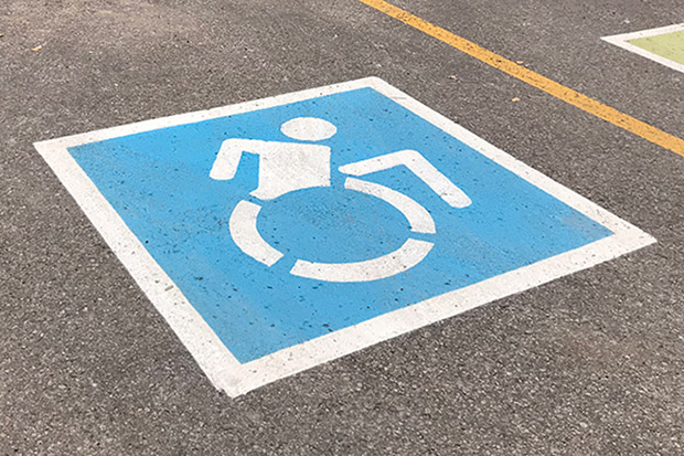 Image of new Dynamic Symbol of Access now appears in accessibility-designated parking spaces on the campus of the University of Ontario Institute of Technology.