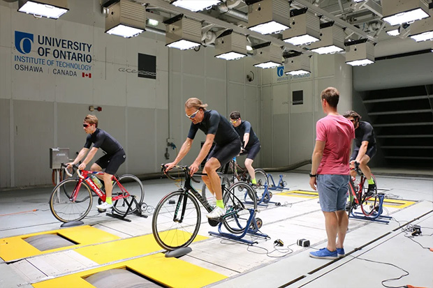 Cyclists pedal on stationary bikes in the ACE Climatic Wind Tunnel as cycling garment manufacturer PEARL iZUMi measures how new products dissipate heat from riders' bodies in varying temperatures, humidity and precipitation conditions. 