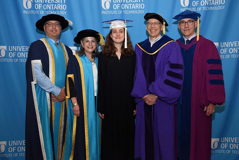 University of Ontario Institute of Technology graduate student Samantha Stahlke (centre, pictured with academic dignitaries at Convocation in June 2018 for winning the Faculty of Business and Information Technology medal for highest grade-point average for her undergraduate Bachelor of Information Technology degree) is among the inaugural recipients of the Vector Institute Scholarship in Artificial Intelligence.