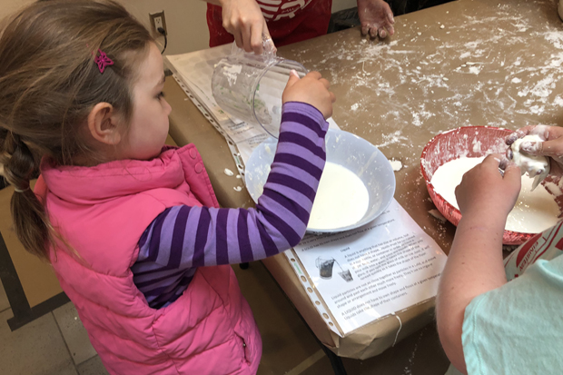 Kids playing with slime at Science Rendezvous