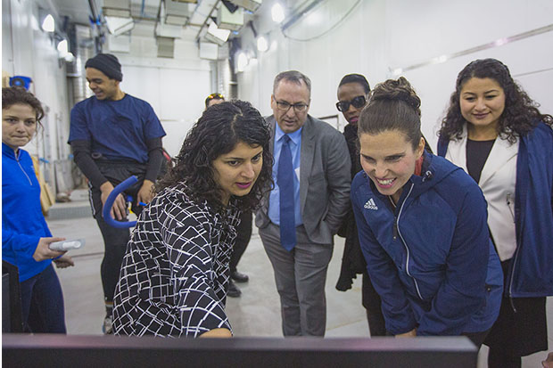 Dr. Shilpa Dogra, Associate Professor and Director of Kinesiology, Faculty of Health Sciences (front left) with The Honourable Kirsty Duncan, Minister of Science and Sport (front right) at Ontario Tech University's ACE (February 11, 2019). Onlooking are Dr. Steven Murphy, President, Ontario Tech University; Celina Caesar-Chavannes, Whitby MP (both in centre-back), and (right) The Honourable Maryam Monsef, Minister for Women and Gender Equality (also Minister of International Development as of March 1, 2019).