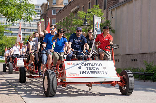 University President Dr. Steven Murphy leads team members from Ontario Tech in the Big Bike ride through downtown Oshawa.