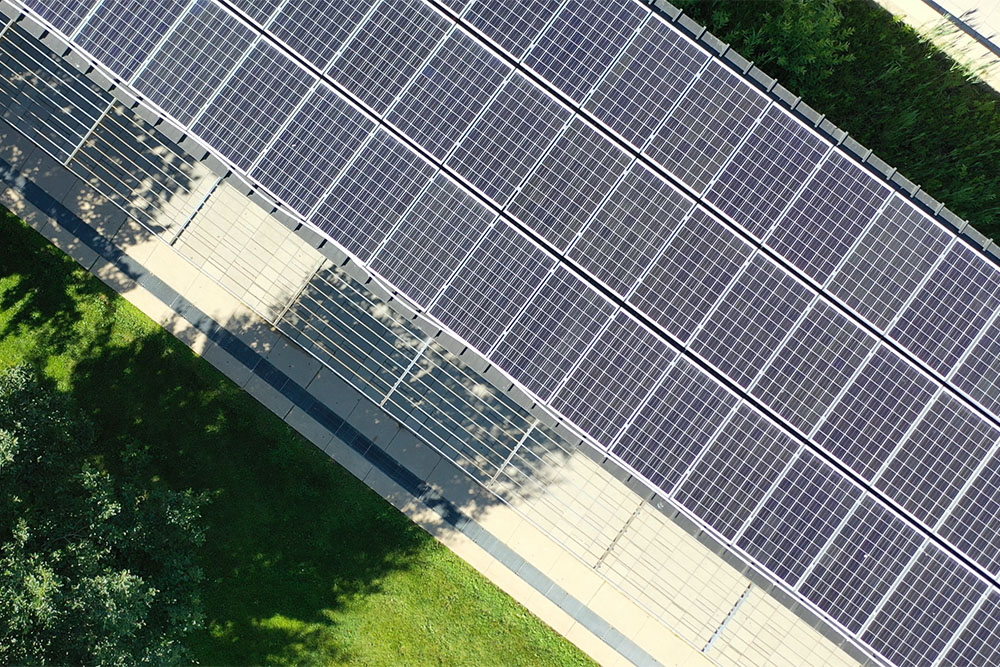 Overhead view of solar panels atop the covered promenade on the west side of Polonsky Commons at Ontario Tech University's north Oshawa location.