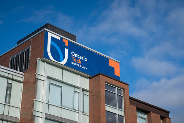 New Ontario Tech logo at the top of the Business and Information Technology Building (north Oshawa location).
