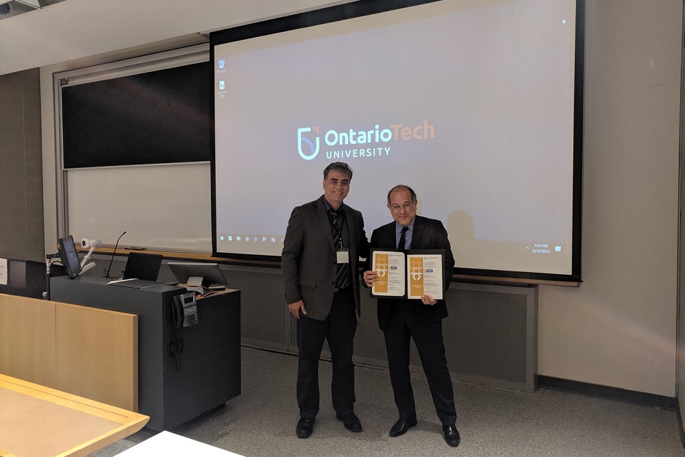 IMS Conference Chair Dr. Ahmad Barari, Ontario Tech University, presented the first-place award to Professor Marcos de Sales Guerra Tsuzuki, University of Sao Paulo, Brazil, for Best Industry Research Paper.