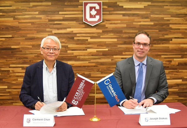 Joe Stokes, PhD, Registrar, Ontario Tech University (right), and Clement Chan, Executive Director, Columbia International College, sign a new partnership that provides international students with admission opportunities at Ontario Tech.