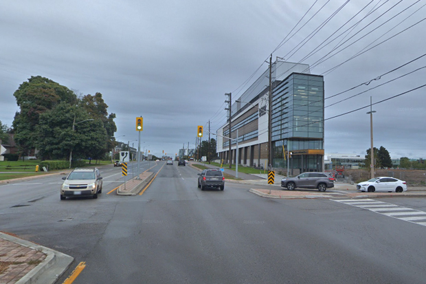 Simcoe Street and Founders Gate, looking south. The sidewalk on the west side of Simcoe Street is closed due to repairs.