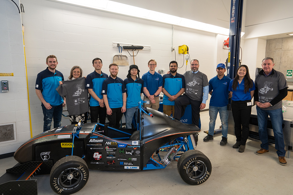 Ontario Tech Racing team with members of the university's senior leadership.