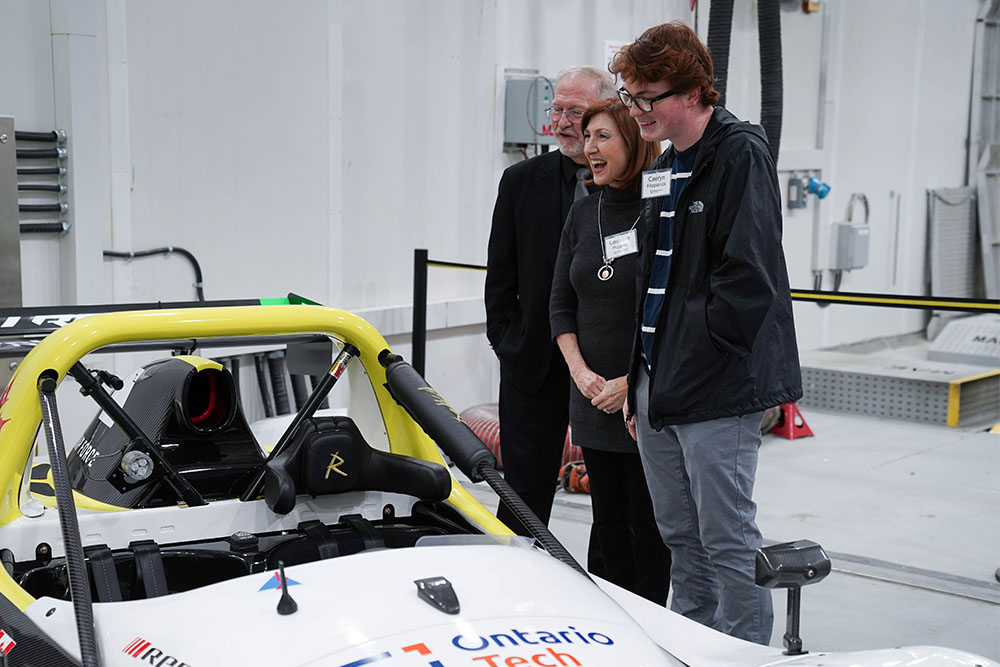 Guests check out Doug Allingham's SR3 RS race car in one of the ACE Climate Chambers.