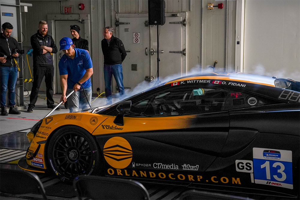 Smoke wand demonstrating airflow over a race car in the ACE Climatic Wind Tunnel.