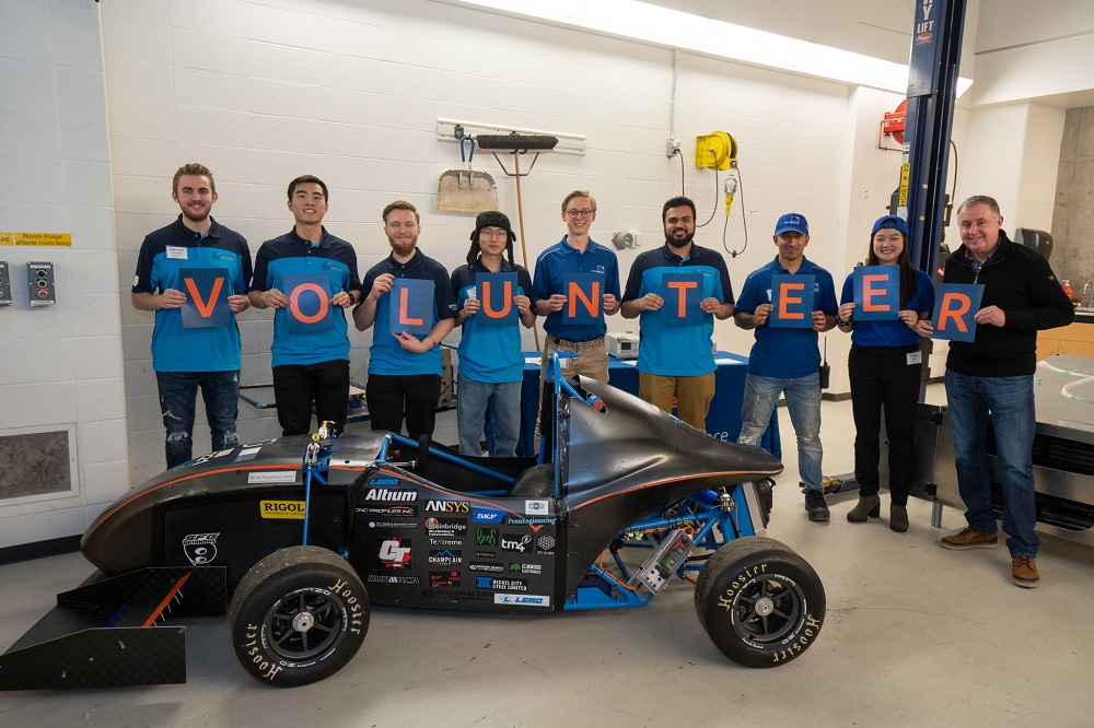 Douglas Allingham, Chair, Ontario Tech University Board of Governors (far right), with student volunteers.