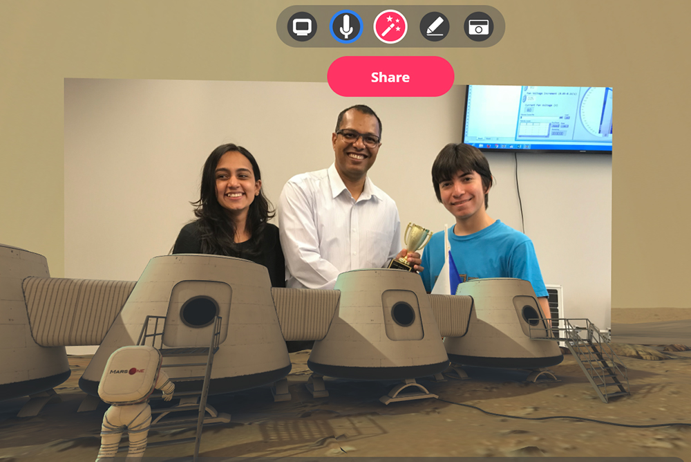 Mars virtual reality background: Sharman Perera, Associate Teaching Professor and Laboratory Manager, Faculty of Energy Systems and Nuclear Science (FESNS, centre) presents an award in the FESNS Wind Chamber Lab to high school students from Jamaica's Hillel Academy for winning a 2019 FESNS design competition. The students were visiting Ontario Tech University as a part of the International Enrichment program conducted by Ontario Tech's Office of the Registrar.    