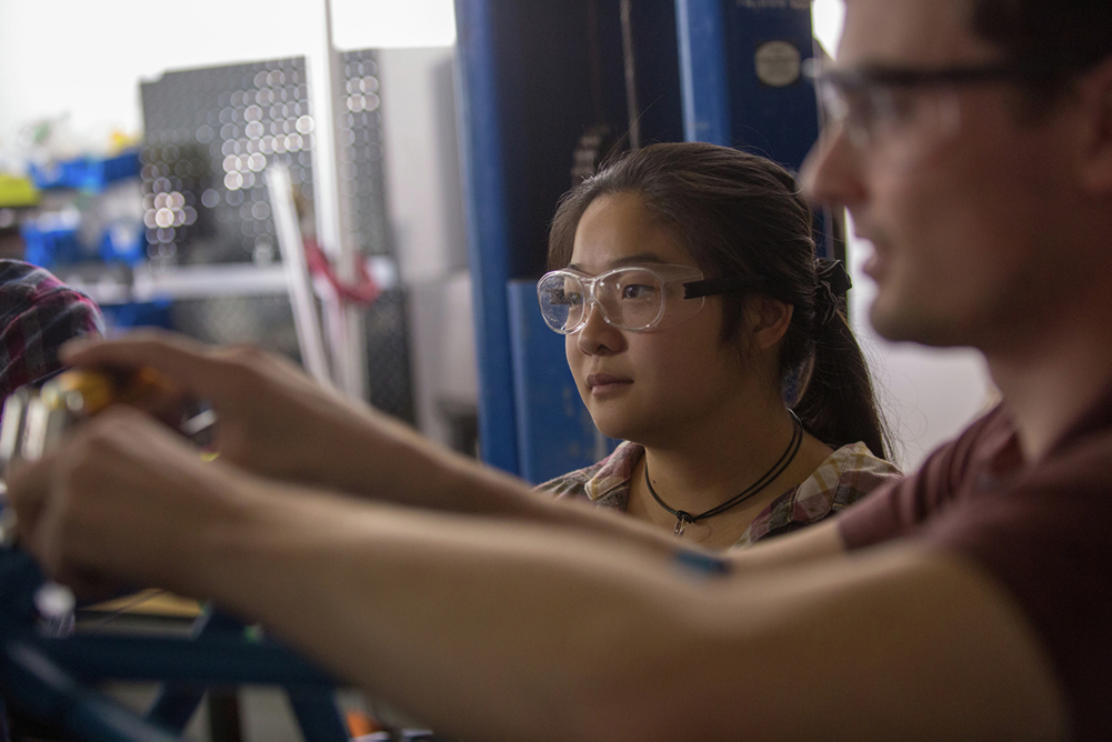 Ontario Tech University's engineering research portfolio continues to demonstrate strong results in the influential U.S. News and World Report international survey of engineering schools (left: third-year Mechanical Engineering student Fiona Man works on the Ontario Tech Racing electric car). 