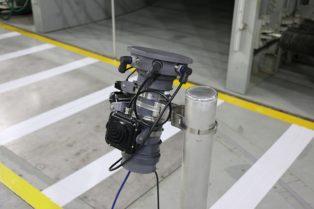 SmartCone hardware equipped with radar and lidar (light detection) sensors mounted in front of a mock crosswalk in the ACE Climatic Wind Tunnel to detect a pedestrian’s walking speed.  