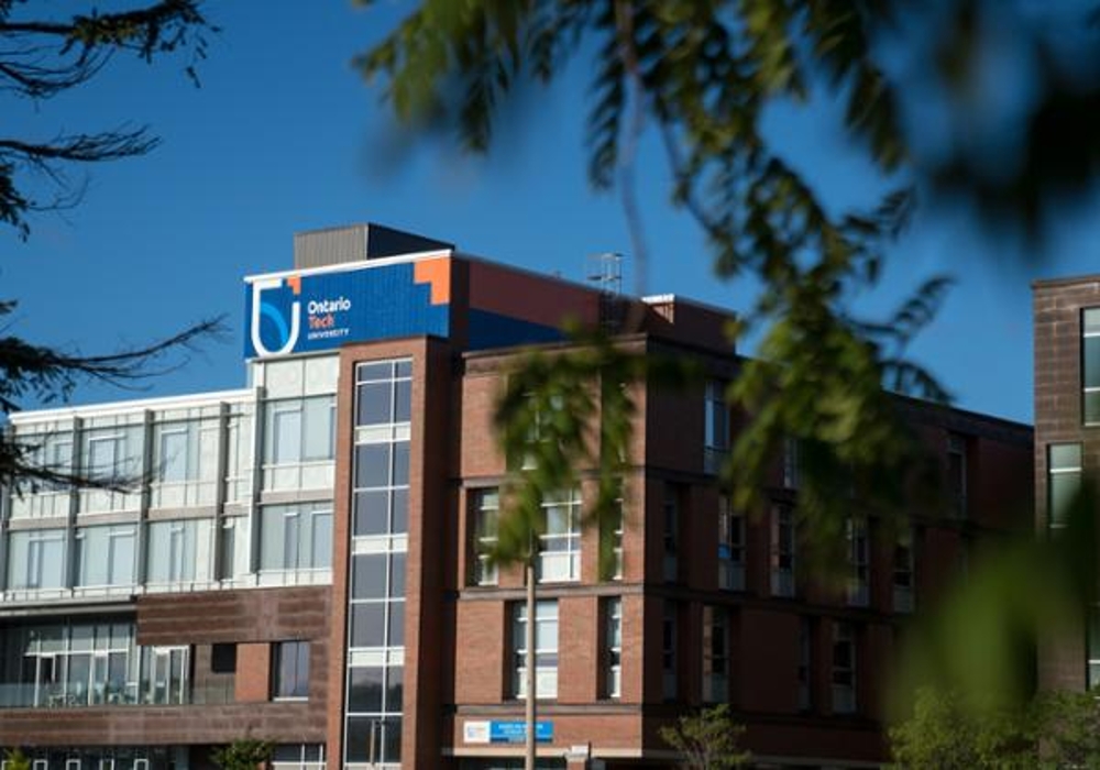 Photo of a campus building with the Ontario Tech logo.