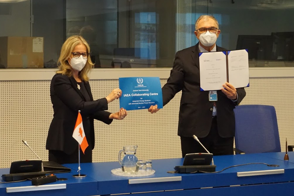 Heidi Hulan, Ambassador of Canada to Austria, and Chair, IAEA Board of Governors (left) and Mikhail Chudakov, IAEA Deputy Director General and Head of the Department of Nuclear Energy hold plaque confirming Ontario Tech University's designation as an IAEA Collaborating Centre (virtual ceremony in Vienna, Austria, April 22, 2021).  