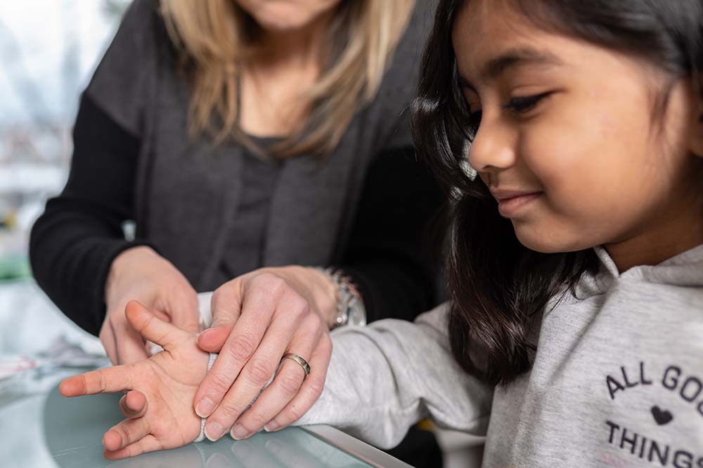 Providing care to a young patient at The Charles H. Best Diabetes Centre.