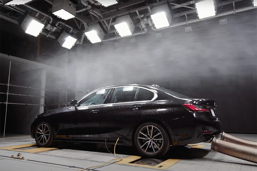 Aerodynamic testing of a vehicle in front of the nozzle of the ACE Climatic Wind Tunnel at Ontario Tech University.