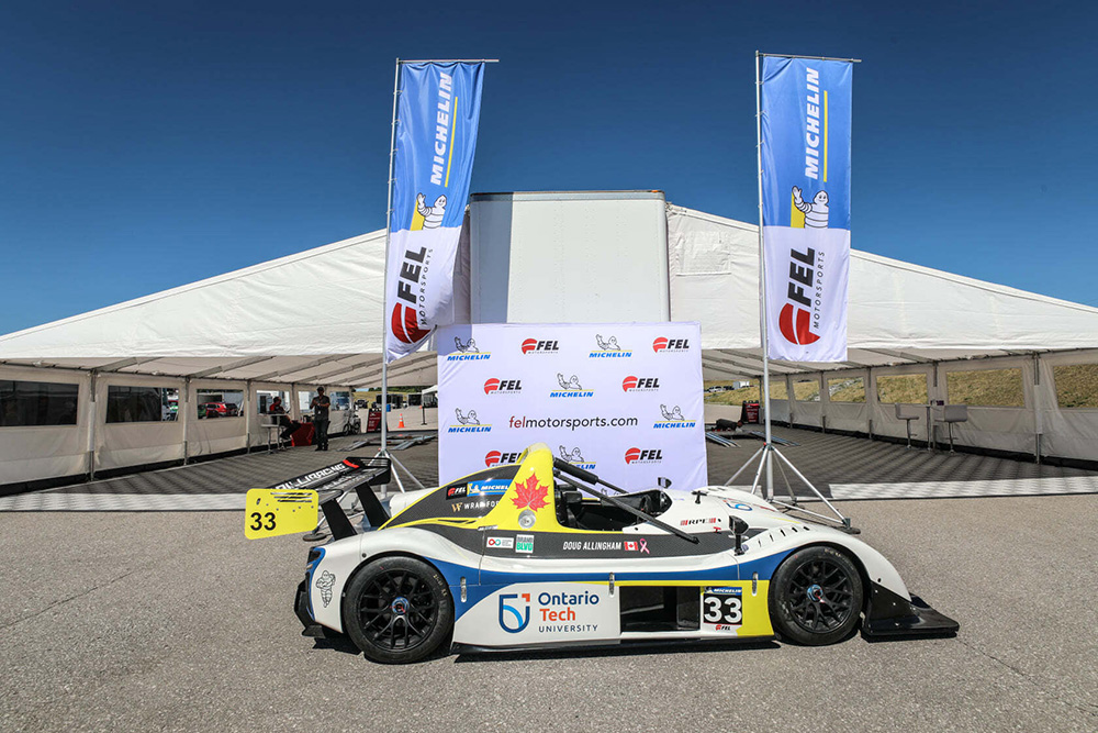 A Radical racecar owned and operated by Allingham Motorsports, on display at the 2021 Emzone Radical Cup Canada.