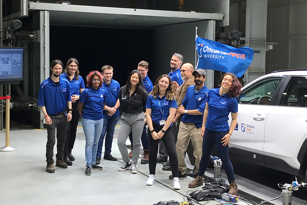 Ontario Tech University senior students strike a 'fun' pose in the ACE Climatic Wind Tunnel, adjacent to the new Moving Ground Plane (May 26, 2022).