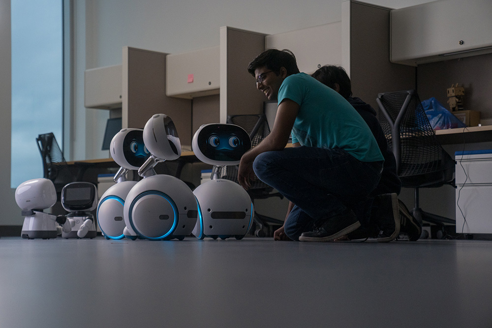Ontario Tech students interacting with Zenbo social robots.