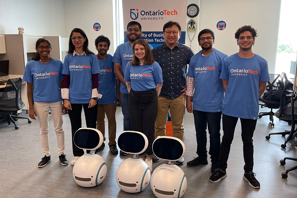 From left: Priya Asse (Mitacs Globalink undergraduate student**); Jasmine Madaan (Mitacs Globalink undergraduate student*); Rupendra Raavi (Ontario Tech master's degree student in Computer Science*); Mohammed Abid (Ontario Tech master's degree student in Computer Science*);  Iryna Parkhomchuck (Ukrainian undergraduate student under Mitacs Globalink*); Dr. Patrick Hung, Professor, Faculty of Business and Information Technology (FBIT), Ontario Tech; Nikhil Gupta (Ontario Tech master's degree student in Information Technology Security*); Josue Daniel Valejo Coss (Mitacs Globalink undergraduate student*).*Supervised by Dr. Hung.**Supervised by Dr. Miguel Vargas Martin, FBIT.