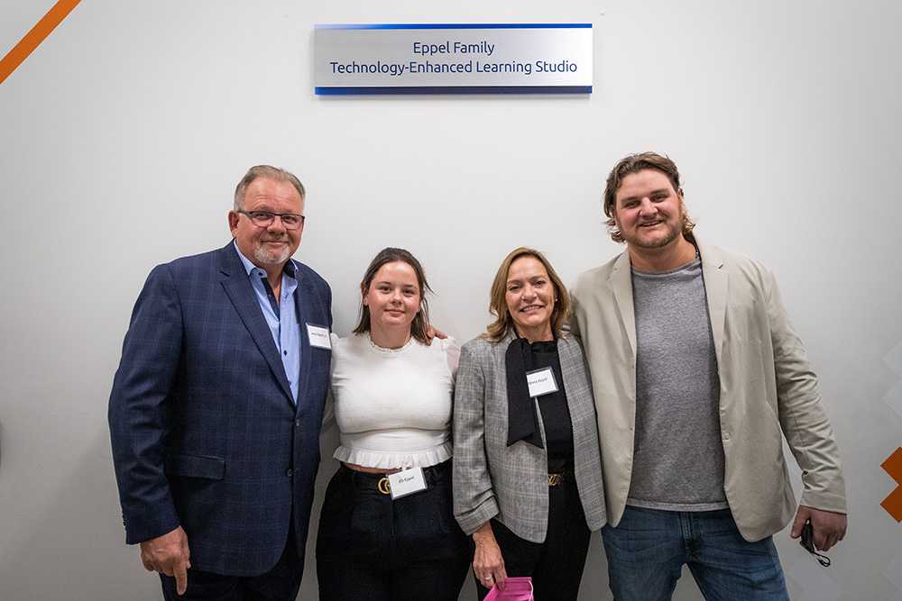 From left: Jeno Eppel, Jill Eppel, Diane Eppel, and Jake Eppel in front of the Eppel Family Technology-Enhanced Learning Studio (Shawenjigewining Hall, at Ontario Tech University’s north Oshawa location).