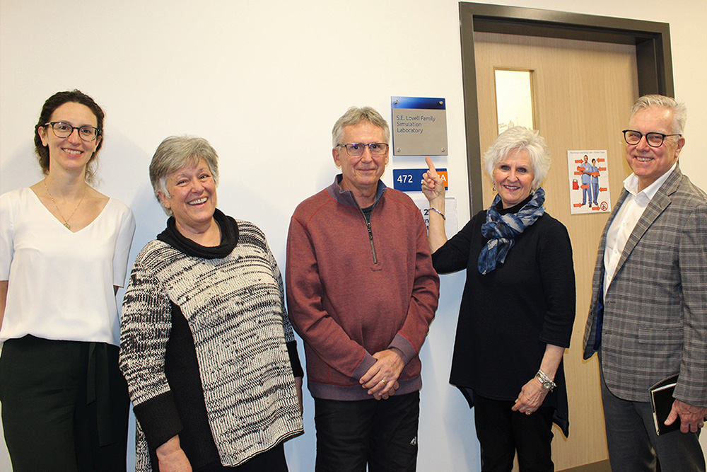 Unveiling of the S.E. Lovell Family Nursing Innovation Laboratory in Shawenjigewining Hall, at Ontario Tech University's north Oshawa location (March 1, 2023). From left: Dr. Janet McCabe, Associate Dean, Nursing, Faculty of Health Sciences, Ontario Tech University; with Lovell Family representatives Linda McGill, Arthur Lovell and Diana Kirk; and Clive Waugh, Director, Gift Planning, Office of Advancement, Ontario Tech University