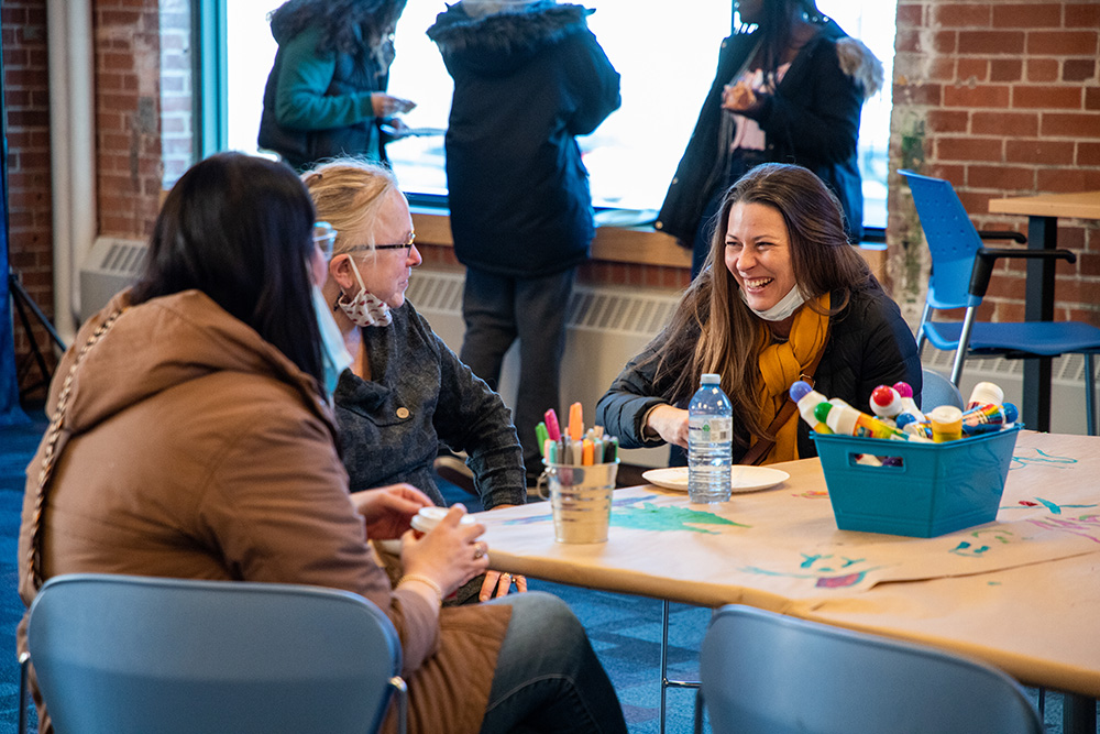 Ontario Tech University Faculty of Social Science and Humanities students, faculty and staff enjoying time together at the first-ever Perfect Slice of Downtown (Oshawa) pizza party