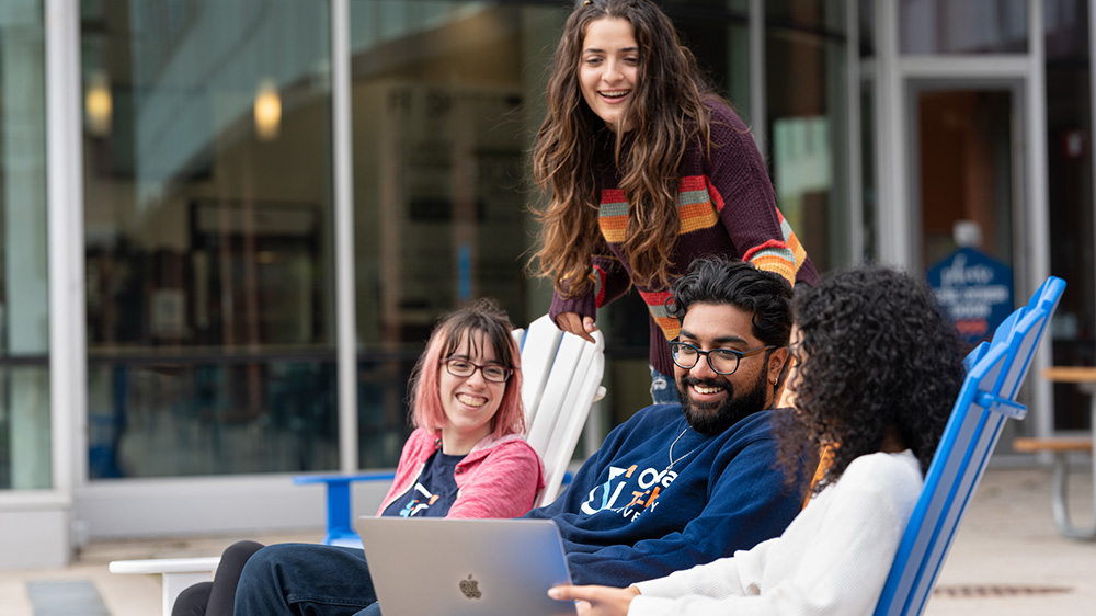 A group of students sitting in Polansky Commons