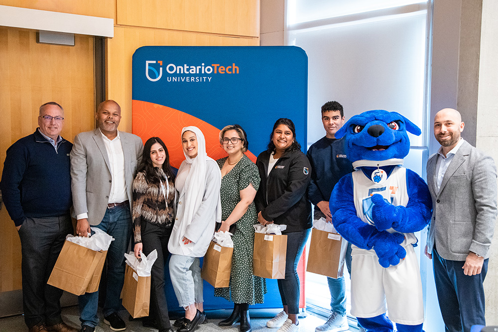 Brilliant Catalyst Team members Connor Loughlean; Denzel Sheppard-Thompson; Leen Jaber; Lina Hamouda; Marissa George; Maryam Akhtar; and Osman Hamid received the U Make A Mark award from Dr. Steven Murphy, President and Vice-Chancellor, Ontario Tech University and Jamie Bruno, Vice-President, People and Transformation.