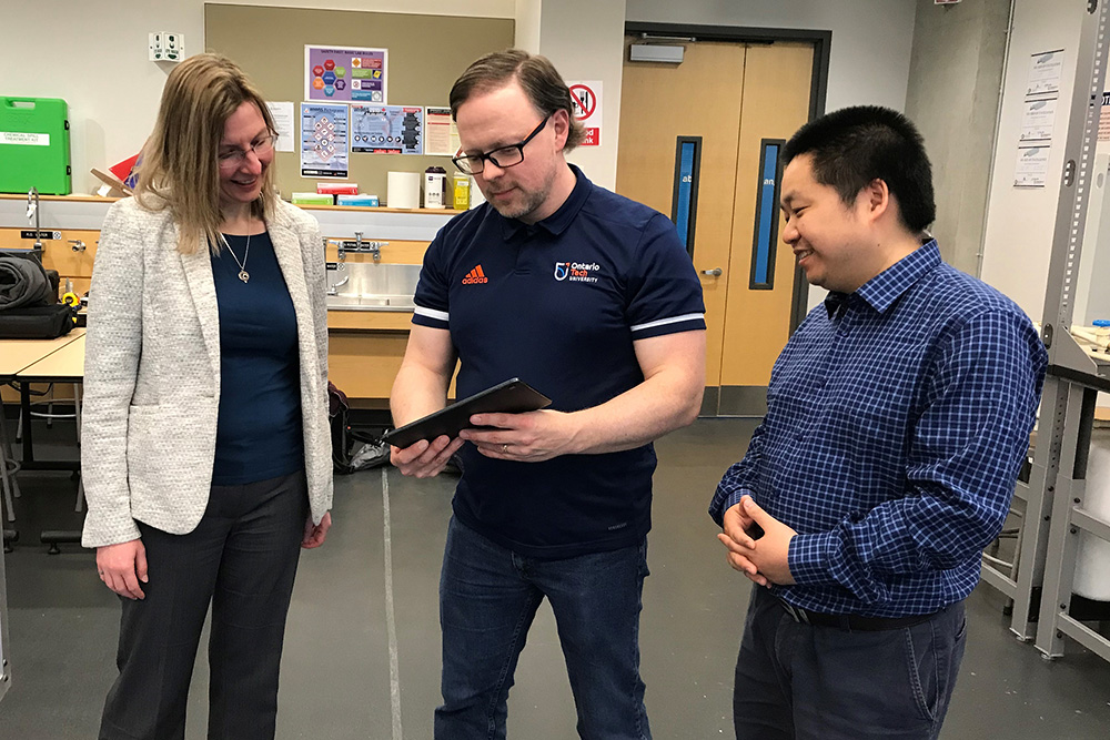 From left: Faculty of Engineering and Applied Science researchers Dr, Jennifer McKellar, Dr. Kirk Atkinson and Dr. Xianke Lin, in Ontario Tech University's Energy Research Centre.
