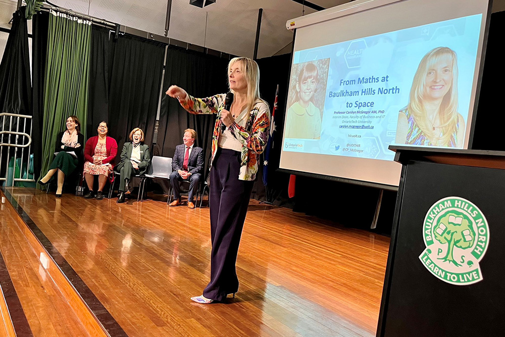 image of Ontario Tech researcher Dr. Carolyn McGregor talks to elementary students at Australia's Baulkham Hills North Public School.