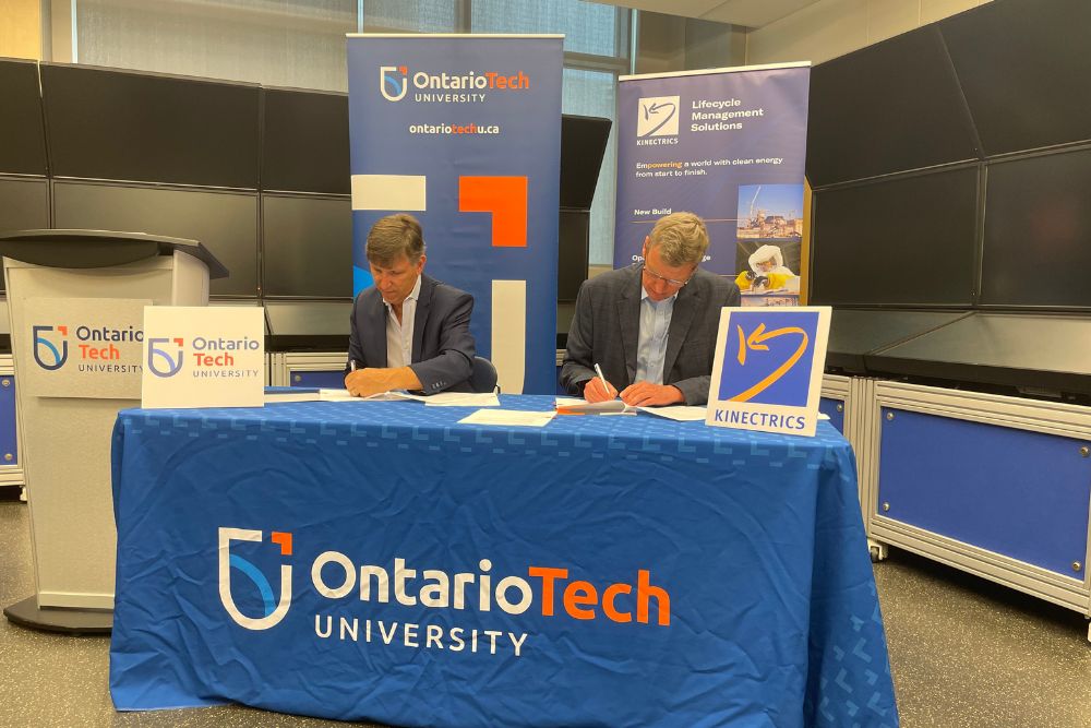 Dr. Les Jacobs, Vice-President, Research and Innovation, Ontario Tech University (left) and David Harris, CEO, Kinectrics Inc. sign Memorandum of Understanding (August 10, 2023).